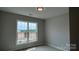 Bedroom bathed in natural light features large window at 113 Tonbridge Way # Haf0031, Mooresville, NC 28115