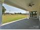 Covered patio overlooking a large grassy backyard with open views and fresh air at 113 Tonbridge Way # Haf0031, Mooresville, NC 28115