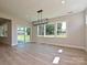 Bright dining area with large windows and sliding glass door to outdoor space at 113 Tonbridge Way # Haf0031, Mooresville, NC 28115