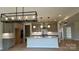 Gorgeous kitchen featuring stainless steel appliances, a kitchen island, and pendant lighting at 113 Tonbridge Way # Haf0031, Mooresville, NC 28115