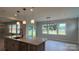 Open kitchen with an island, stainless steel appliances and recessed and pendant lighting at 113 Tonbridge Way # Haf0031, Mooresville, NC 28115