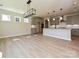 Open-concept kitchen and dining area featuring grey cabinets, an island, and modern light fixtures at 113 Tonbridge Way # Haf0031, Mooresville, NC 28115