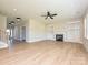 Spacious living room with a fireplace, built-in shelving, and natural light at 113 Tonbridge Way # Haf0031, Mooresville, NC 28115