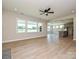 Open-concept living space with generous natural light, ceiling fan, and access to the kitchen at 113 Tonbridge Way # Haf0031, Mooresville, NC 28115