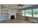 A living room with built-in shelving and a fireplace at 113 Tonbridge Way # Haf0031, Mooresville, NC 28115