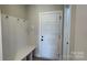 Welcoming mudroom with convenient bench and coat hooks, providing practical entryway storage at 113 Tonbridge Way # Haf0031, Mooresville, NC 28115