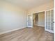 Bright room with modern floors and double french doors leading to a staircase at 113 Tonbridge Way # Haf0031, Mooresville, NC 28115