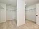 Spacious walk-in closet with ample shelving and carpeted flooring at 113 Tonbridge Way # Haf0031, Mooresville, NC 28115