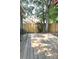 The spacious wooden deck overlooks the fenced backyard, providing a serene outdoor living and entertainment area at 11421 Kingfisher Dr, Charlotte, NC 28226