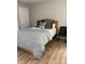 Comfortable bedroom with a neutral color palette, cozy bedding, and ample natural light creating a relaxing retreat at 11421 Kingfisher Dr, Charlotte, NC 28226