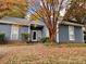 Charming single-story home featuring mature landscaping and a freshly painted exterior, creating an inviting curb appeal at 11421 Kingfisher Dr, Charlotte, NC 28226