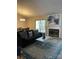Spacious living room with a fireplace, comfortable seating, and an open layout connecting to the dining area at 11421 Kingfisher Dr, Charlotte, NC 28226