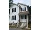 Charming two-story home with white siding, black shutters, and a welcoming front porch at 118 Fir St, Mcadenville, NC 28101