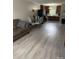 Bright and open living area with new vinyl floors, open kitchen, and dining area at 118 Fir St, Mcadenville, NC 28101