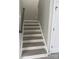 A well-lit staircase leads to the upper level of this inviting home at 118 Fir St, Mcadenville, NC 28101