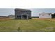Spacious backyard featuring a covered porch, offering ample outdoor living and entertaining space at 119 Tonbridge Way # Haf0033, Mooresville, NC 28115