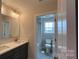 Well-lit bathroom with modern fixtures, featuring a double vanity and a combination shower and tub at 119 Tonbridge Way # Haf0033, Mooresville, NC 28115
