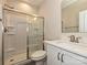 Modern bathroom featuring a glass-enclosed shower, sleek vanity with marble countertop, and toilet at 119 Tonbridge Way # Haf0033, Mooresville, NC 28115