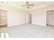 Spacious bedroom featuring a tray ceiling with fan and neutral carpeted floors at 119 Tonbridge Way # Haf0033, Mooresville, NC 28115