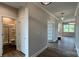 Hallway showcasing hard wood floors, neutral paint, and entryways to a bathroom and other rooms at 119 Tonbridge Way # Haf0033, Mooresville, NC 28115