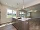 Modern kitchen with a center island, stainless steel appliances, ample counter space, and an open layout at 119 Tonbridge Way # Haf0033, Mooresville, NC 28115