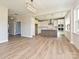 Bright, open kitchen features modern appliances, tile backsplash, a kitchen island and hardwood floors at 119 Tonbridge Way # Haf0033, Mooresville, NC 28115