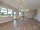 Bright living room with hardwood floors, a glass door to the backyard and plenty of natural light at 119 Tonbridge Way # Haf0033, Mooresville, NC 28115