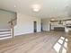 Spacious living room with hardwood floors, recessed lighting and a view of the modern kitchen at 119 Tonbridge Way # Haf0033, Mooresville, NC 28115