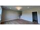 Living room featuring wood floors, a staircase, neutral paint, and recessed lighting at 119 Tonbridge Way # Haf0033, Mooresville, NC 28115