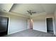 Main bedroom featuring neutral paint, a ceiling fan, carpeted floors, and a tray ceiling at 119 Tonbridge Way # Haf0033, Mooresville, NC 28115