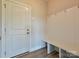 Functional mudroom with a built-in bench, coat hooks, and direct access to the entry door at 119 Tonbridge Way # Haf0033, Mooresville, NC 28115