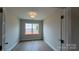 Office showcases hardwood floors, natural light from the window, and a neutral paint color at 119 Tonbridge Way # Haf0033, Mooresville, NC 28115