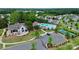 Aerial view of the community pool, clubhouse, tennis court, and parking area, highlighting recreational amenities at 12014 Belmont Mansion Dr, Charlotte, NC 28273