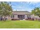 Large, level backyard with a screened porch, stone firepits, and plenty of space for outdoor activities and gatherings at 12014 Belmont Mansion Dr, Charlotte, NC 28273