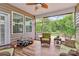Relaxing screened patio with seating area and a view of the backyard at 12014 Belmont Mansion Dr, Charlotte, NC 28273