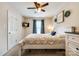Bedroom with ceiling fan, TV, and large bed with blue accents at 1206 Craig Ave, Lancaster, SC 29720