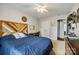Comfortable bedroom featuring a full bed, desk, and a decorative headboard, creating a cozy and inviting space at 1206 Craig Ave, Lancaster, SC 29720
