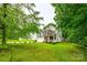 Traditional two-story home with mature trees and a well-kept lawn at 1206 Craig Ave, Lancaster, SC 29720