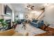 A well-lit living room features hardwood floors, comfortable seating, and a fireplace at 1206 Craig Ave, Lancaster, SC 29720