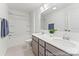 Well-lit bathroom boasts a dual sink vanity, a large mirror, and a shower-tub combo, blending style and functionality at 1216 Links Crossing Dr # 159, Monroe, NC 28112