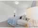 Bright bedroom features soft carpet, neutral walls, and a large bed with stylish pillows, ready for personalization at 1216 Links Crossing Dr # 159, Monroe, NC 28112