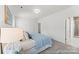 This bright bedroom features neutral walls, soft carpet, and an attached bathroom, ready for personalization at 1216 Links Crossing Dr # 159, Monroe, NC 28112
