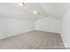 Spacious bonus room with soft carpeting and natural light, adaptable for a playroom, office, or media center at 1216 Links Crossing Dr # 159, Monroe, NC 28112
