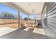 Covered patio with outdoor furniture; perfect for relaxation and entertaining at 1216 Links Crossing Dr # 159, Monroe, NC 28112