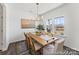 Bright dining room with large windows, stylish chandelier, and ample seating space at 1216 Links Crossing Dr # 159, Monroe, NC 28112