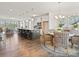 Open floor plan featuring a bright kitchen and a dining area with charming wicker chairs at 1216 Links Crossing Dr # 159, Monroe, NC 28112