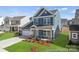 Beautiful two-story home with a well-maintained lawn and inviting curb appeal at 1216 Links Crossing Dr # 159, Monroe, NC 28112