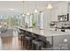 Bright kitchen featuring a large island with seating, stainless steel appliances, and an open layout at 1216 Links Crossing Dr # 159, Monroe, NC 28112