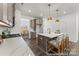 Stylish kitchen with a white quartz island, stainless steel appliances and hardwood floors at 1216 Links Crossing Dr # 159, Monroe, NC 28112