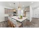 Open concept kitchen with stainless steel appliances, a large island, and ample counter space at 1216 Links Crossing Dr # 159, Monroe, NC 28112